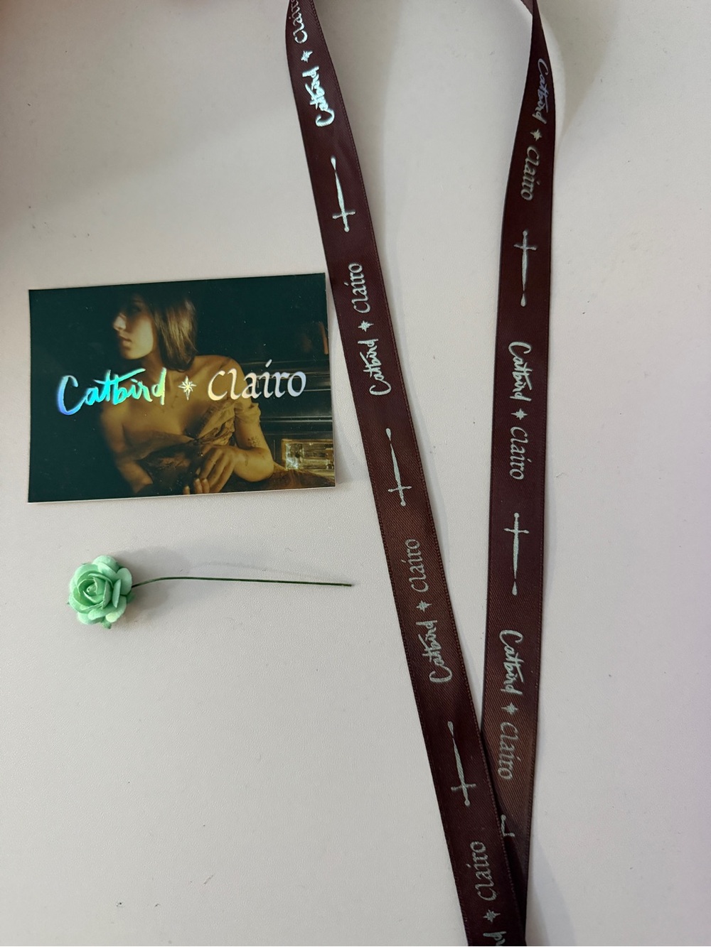 Catbird x Clairo ribbon and sticker